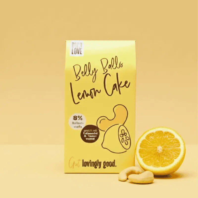 Belly Love Belly Balls Lemon Cake – clean label Bliss Balls überzogen mit heller Alternative zu Schokolade. Wie Zitronenkuchen, industriezuckerfrei viele Ballaststoffe, gesüßt mit Erdmandeln, Yaconwurzel & Datteln für bewussten Genuss.